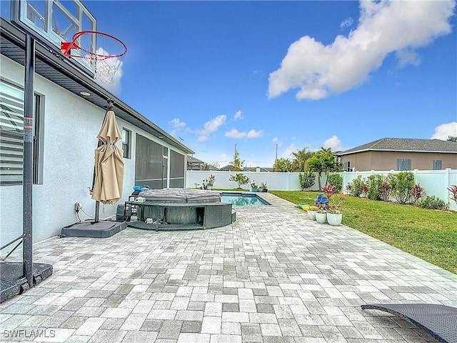 view of patio with a sunroom and a swimming pool with hot tub