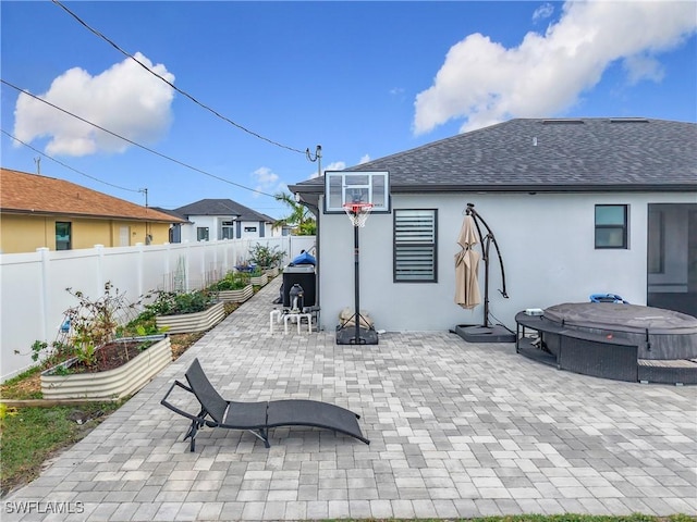 view of patio with a hot tub