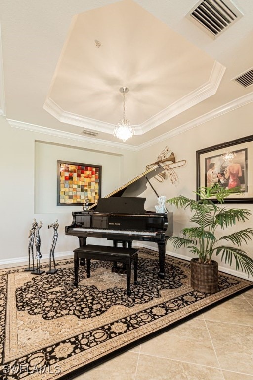 miscellaneous room featuring tile patterned flooring, ornamental molding, a tray ceiling, and a notable chandelier