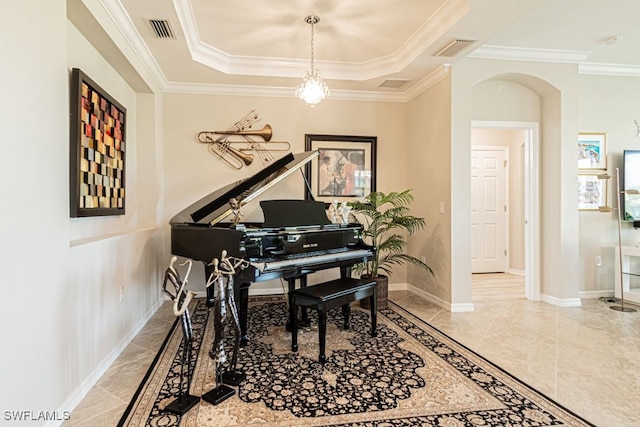 miscellaneous room with a raised ceiling and ornamental molding