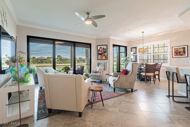 tiled living room with ceiling fan and ornamental molding