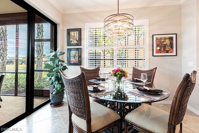 tiled dining space with crown molding and a chandelier