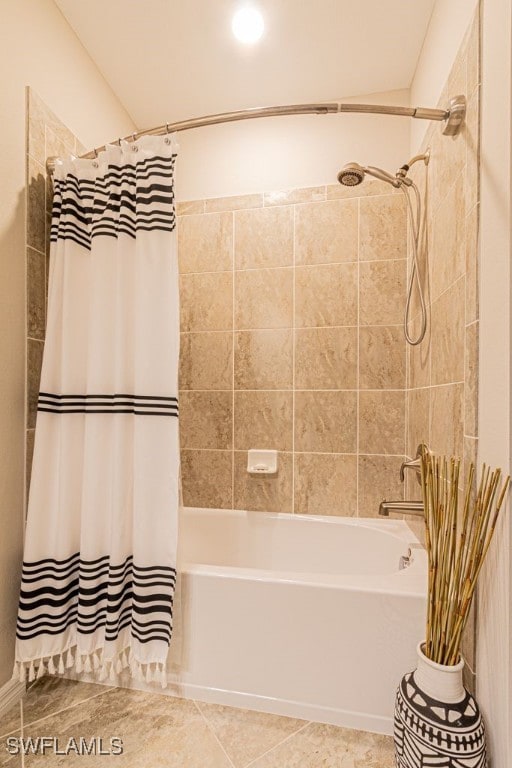 bathroom with tile patterned flooring and shower / bath combo