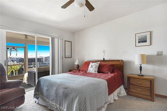 carpeted bedroom featuring access to exterior and ceiling fan