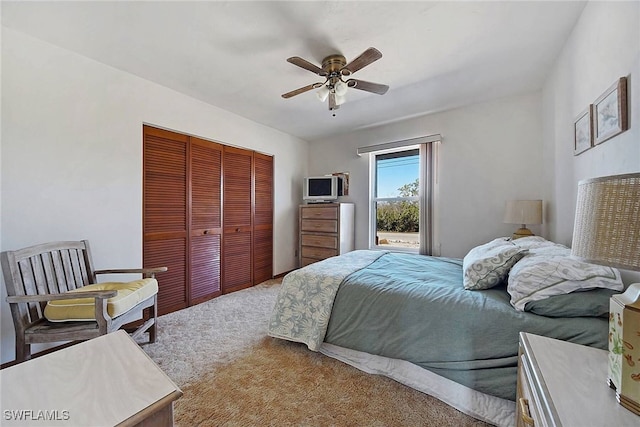 bedroom with carpet flooring, ceiling fan, and a closet