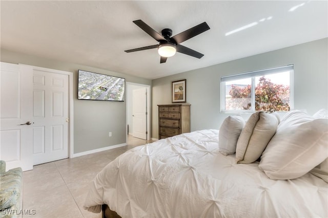 bedroom featuring ceiling fan and light tile patterned flooring