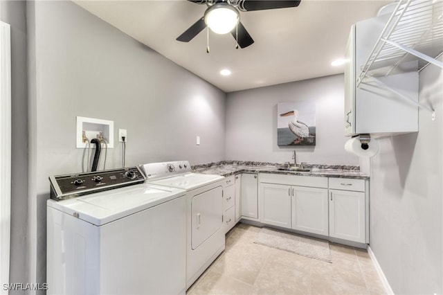 clothes washing area featuring ceiling fan, sink, cabinets, separate washer and dryer, and light tile patterned floors