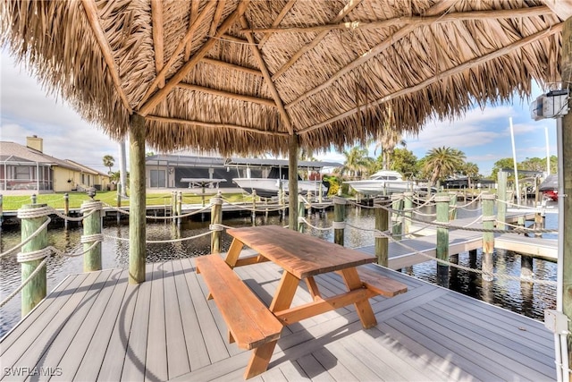 dock area with a gazebo and a water view