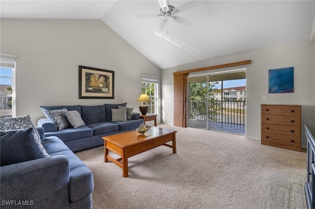 carpeted living room featuring ceiling fan, high vaulted ceiling, and a healthy amount of sunlight