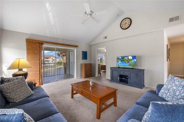 living room with ceiling fan, light colored carpet, and vaulted ceiling