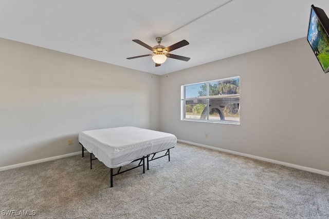 bedroom with light carpet and ceiling fan