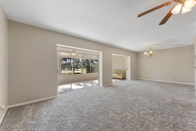 unfurnished room with an inviting chandelier and carpet flooring