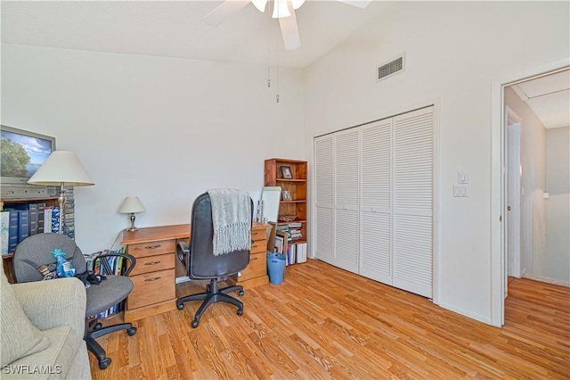 home office with ceiling fan and light hardwood / wood-style flooring