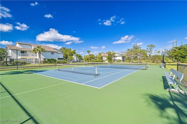 view of sport court with basketball hoop