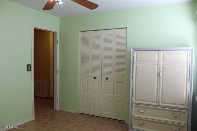 unfurnished bedroom featuring ceiling fan