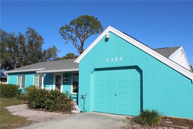 single story home featuring a garage