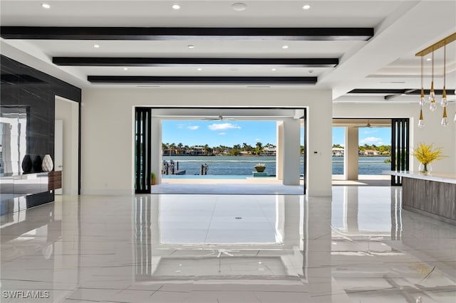 foyer featuring marble finish floor, beamed ceiling, and recessed lighting