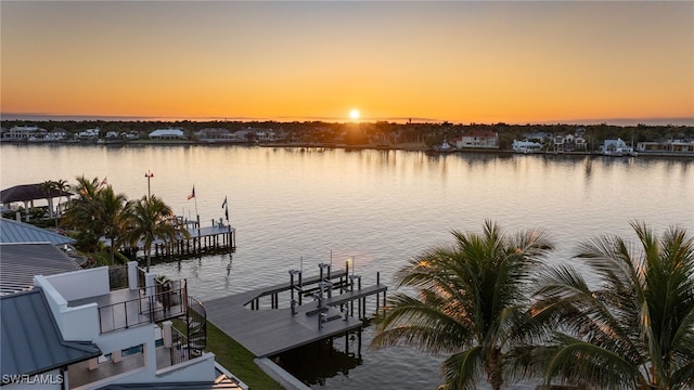 dock area featuring a water view and boat lift