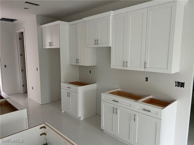 laundry room with light tile patterned flooring