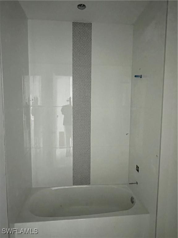 bathroom with shower / bathing tub combination