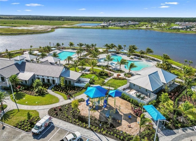 birds eye view of property featuring a water view