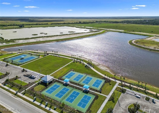 birds eye view of property with a water view