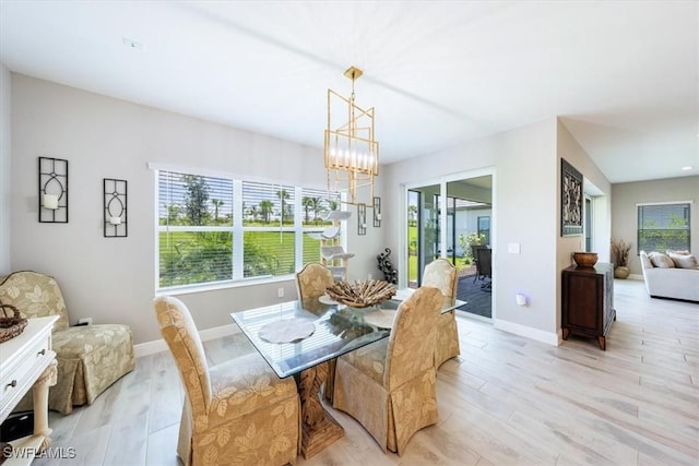 dining room featuring a chandelier and light hardwood / wood-style flooring