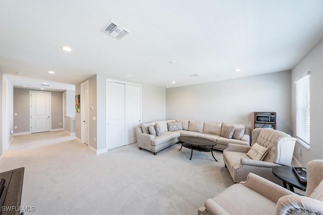 living room featuring light colored carpet