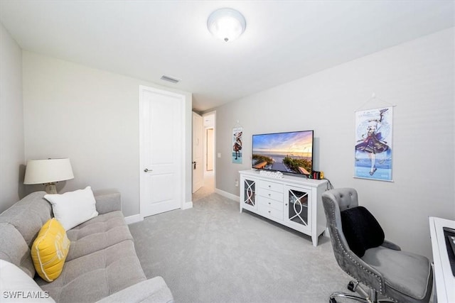 living room with light colored carpet, visible vents, and baseboards