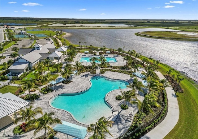 view of pool featuring a water view