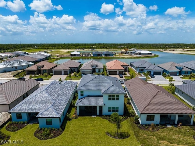 aerial view with a water view and a residential view