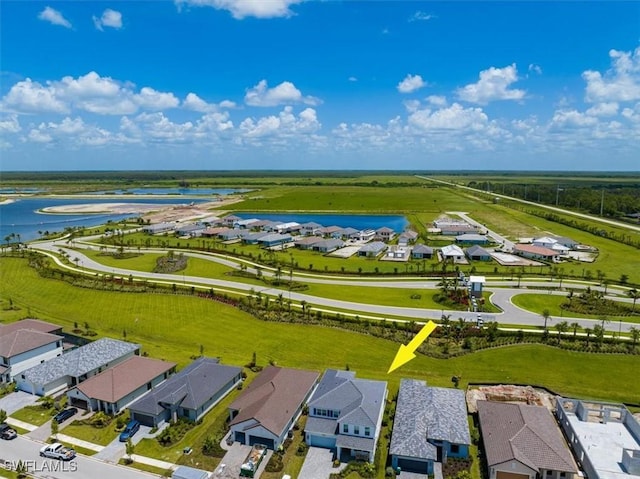 aerial view with a water view and a residential view