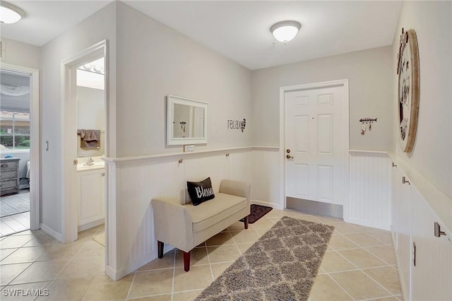 tiled foyer with sink