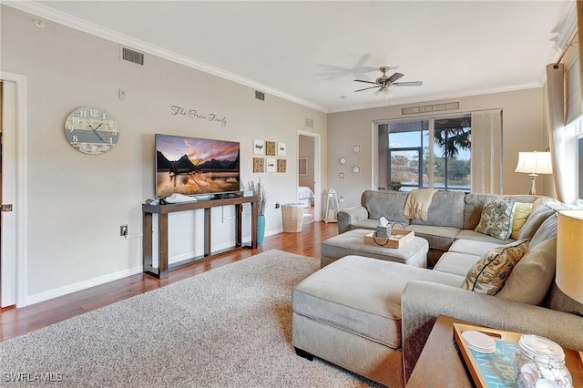 living room with ceiling fan, hardwood / wood-style floors, and ornamental molding