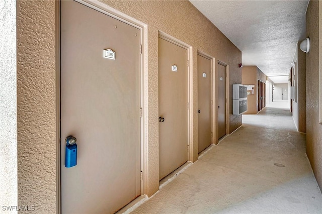 hallway featuring a textured ceiling