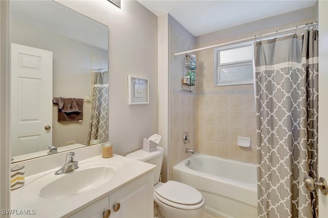 full bathroom featuring vanity, shower / bath combination with curtain, and toilet