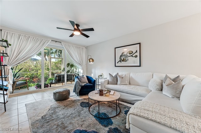 living room featuring light tile patterned floors and ceiling fan