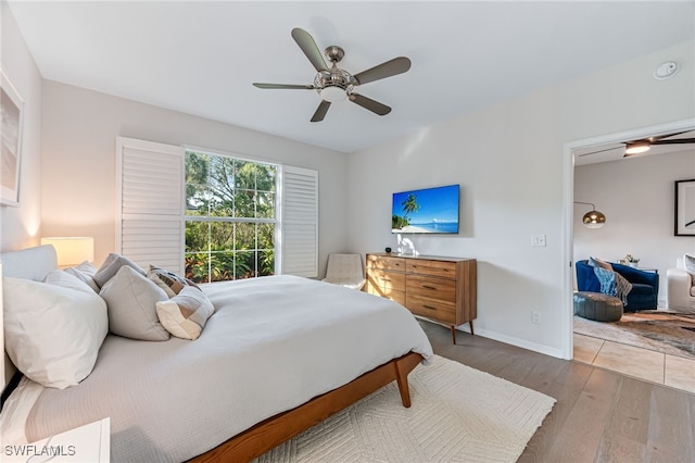 bedroom featuring ceiling fan and hardwood / wood-style floors