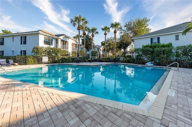 view of swimming pool with a patio area