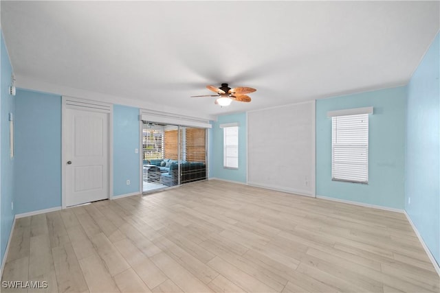 unfurnished living room featuring ceiling fan and light hardwood / wood-style flooring