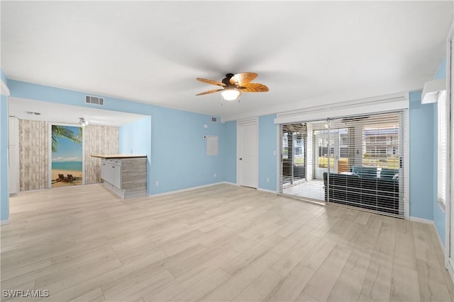 unfurnished room featuring ceiling fan and light wood-type flooring