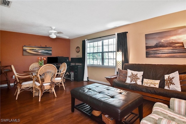 living room with ceiling fan and dark hardwood / wood-style floors