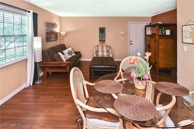 dining space featuring dark hardwood / wood-style floors