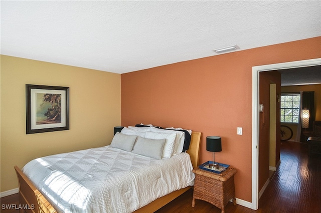 bedroom featuring dark hardwood / wood-style floors