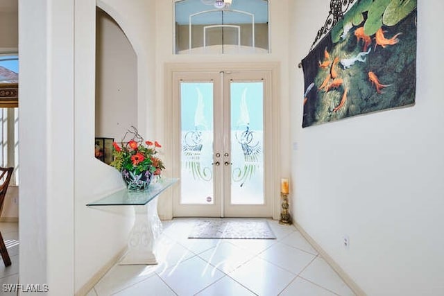 entryway featuring french doors and tile patterned floors