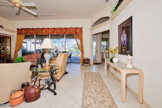 interior space featuring track lighting and ceiling fan