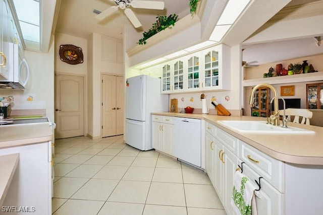 kitchen featuring light tile patterned flooring, sink, white appliances, ceiling fan, and white cabinets