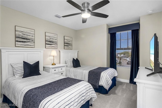 bedroom with ceiling fan and carpet