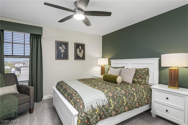 bedroom featuring ceiling fan and carpet