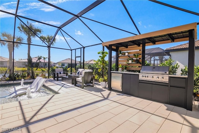 view of patio / terrace with a lanai, area for grilling, and exterior kitchen